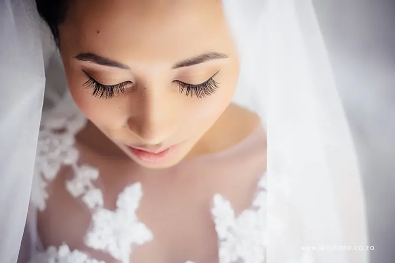 BRidal portrait of stunning makeup done by IZa Cloete